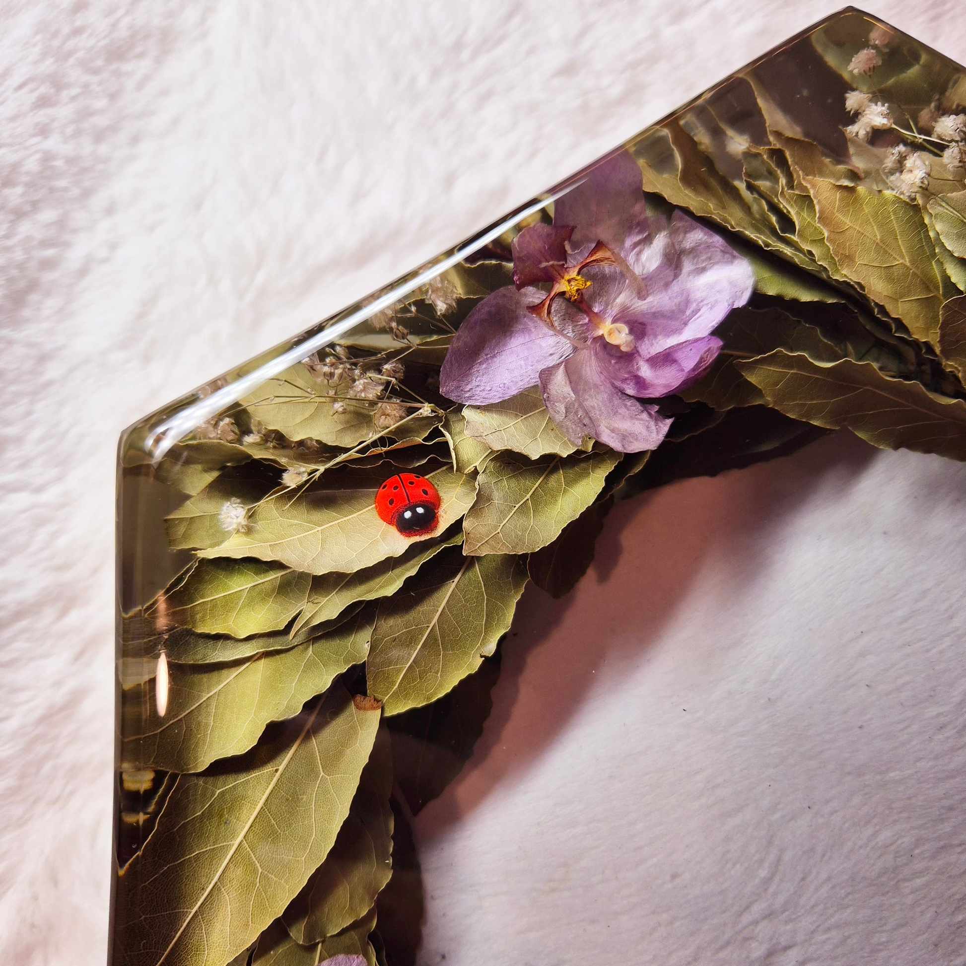 Conservazione corona di alloro in resina