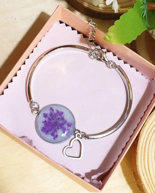 Braccialetti in acciaio, resina e fiori essiccati